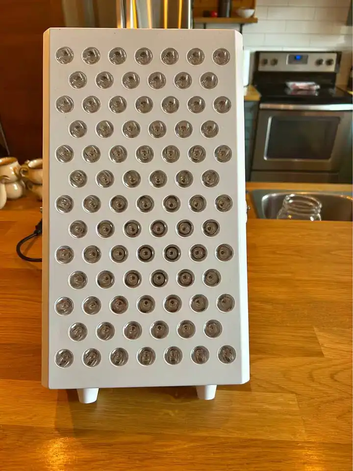 The Kala Pro red light therapy panel being used for treatment.