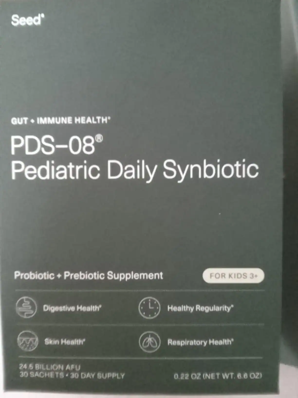 A young child eating yogurt, a common way to administer Seed PDS-08.