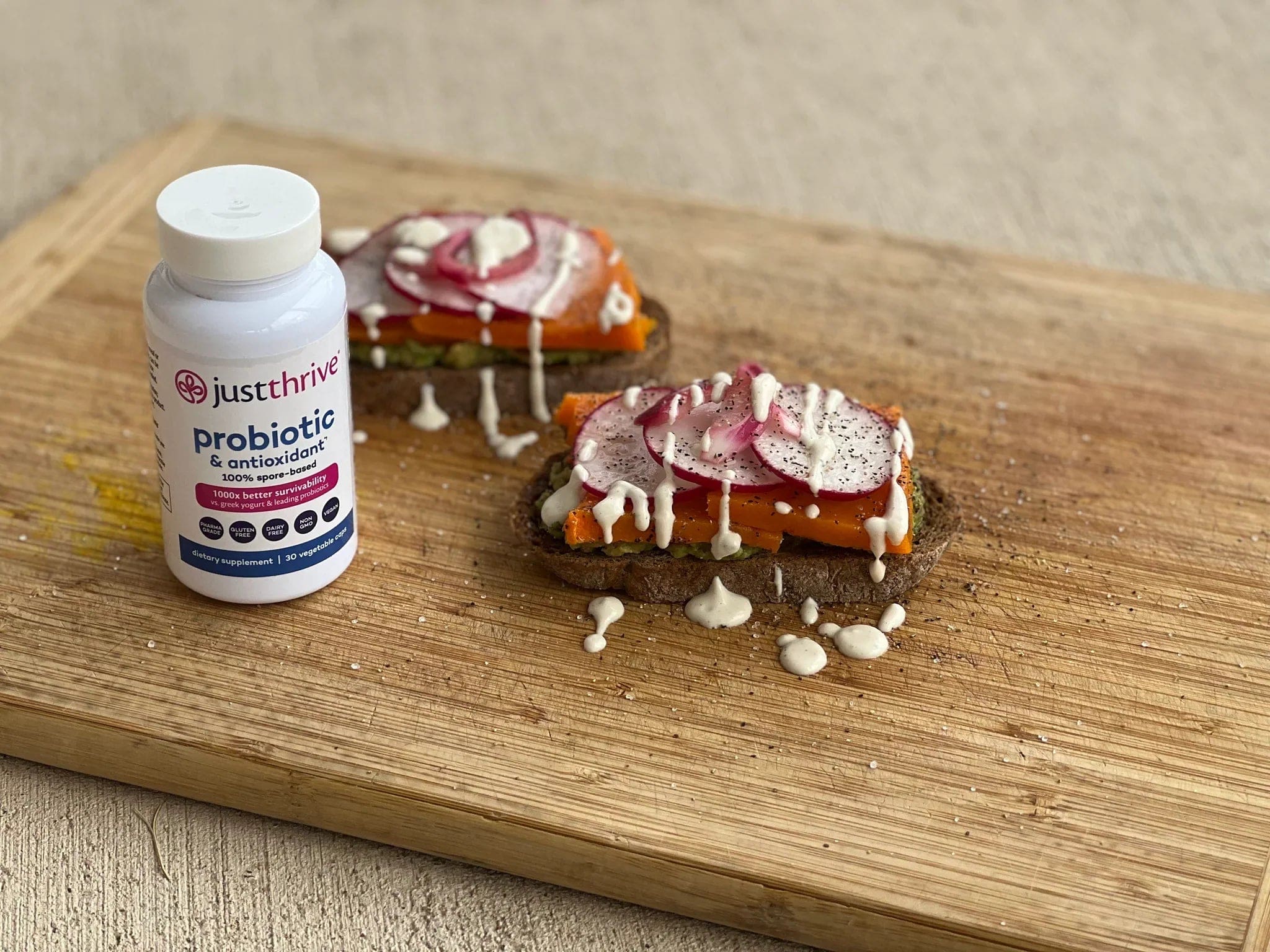a bottle of probiotics on a wooden board