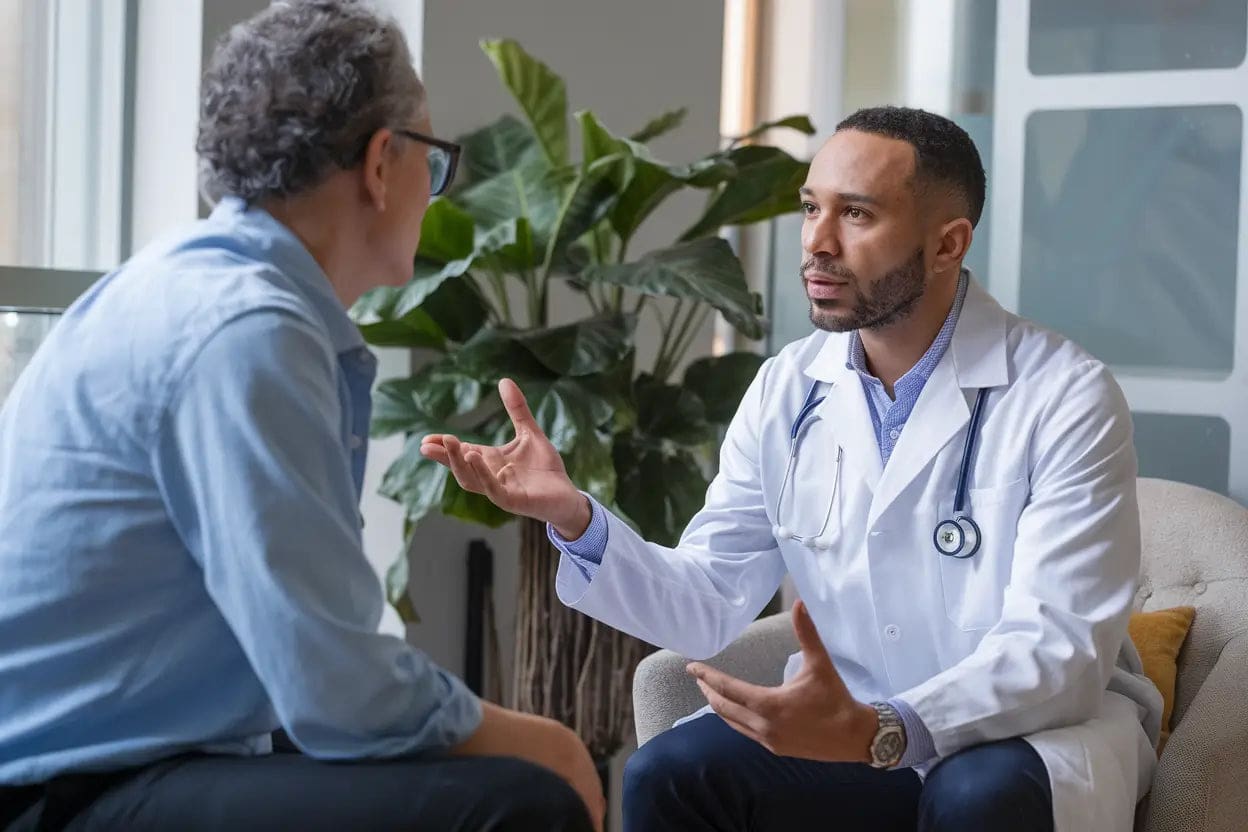A serene setting with a person sitting comfortably while a device emitting PEMF therapy is placed near them. The person appears relaxed and at ease