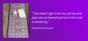 a woman using the sparklemats pemf mat to improve aches and pains in the body